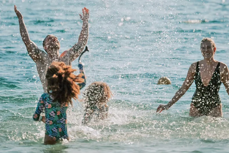 Family enjoying themselves in the lake